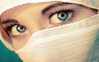 Woman bandage blue eyes looking - a bandage free wallpaper