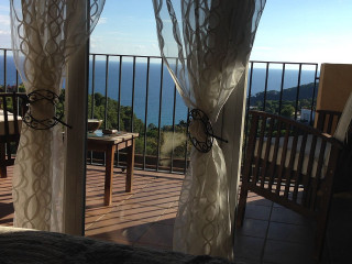 Balcony table chairs ocean view 2 - area free wallpaper