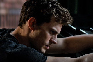 Man playing piano dark room - a piano free wallpaper