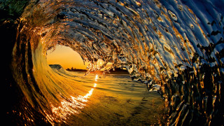 Breaking wave sunset golden water - the background and the water free wallpaper