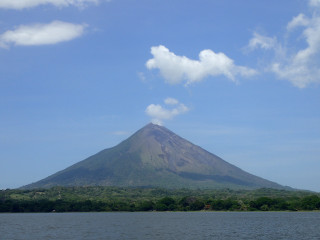 Mountain water trees boat shore - a large mountain free wallpaper