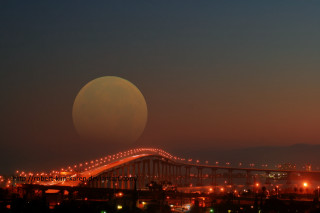 Full moon bridge night lights - a city in the background free wallpaper