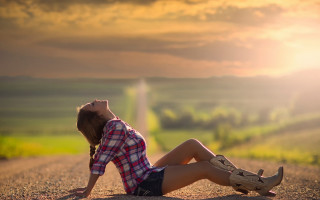 Woman sitting road head down - the side of a road free wallpaper