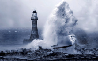 Lighthouse large wave crashing ocean - a lighthouse in the background free wallpaper