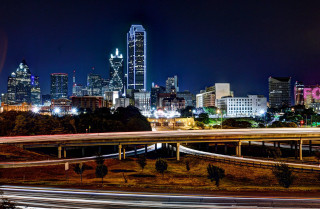 City skyline night freeway bridge - a city skyline in the background free wallpaper for desktop
