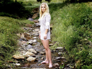 Woman standing stream field grass - free forest wallpaper for desktop