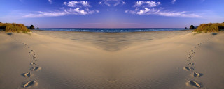 Beach footprints ocean blue sky - surrealism free wallpaper