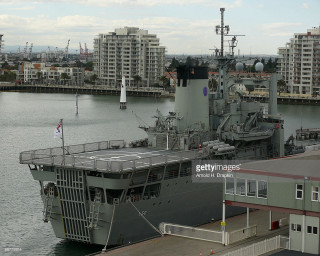 Large ship docked harbor city 2 - anson maddock free wallpaper