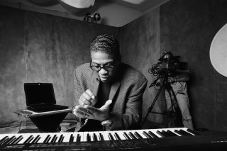 Man sitting piano camera laptop - a piano free wallpaper