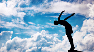 Person standing rock arms in - fabien charuau free wallpaper