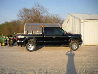 Black truck building tractor man - a black truck free wallpaper