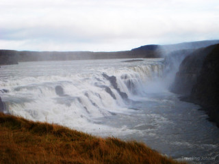 Waterfall man river cliff nature - side next free wallpaper