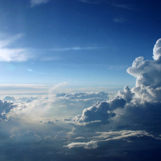 Sky clouds sunlight cityscape ocean - free airplane wallpaper for tablet