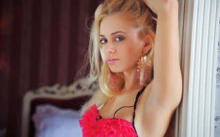 Woman pink dress leaning wall - against free wallpaper