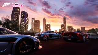 Cars driving street tall buildings - a group of cars free wallpaper for desktop