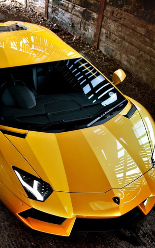 Yellow sports car parking lot 10 - a yellow sports car free wallpaper for mobile