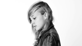 Young girl leather jacket cellphone - studio portrait free wallpaper