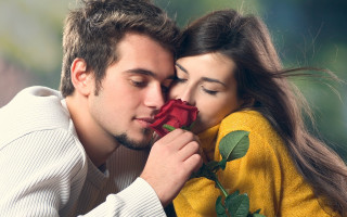 Man woman kissing holding rose 3 - free valentines wallpaper for desktop