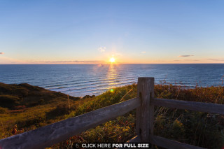 Wooden fence hill ocean sunset - a wooden fence free wallpaper