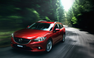 Red car driving forest sunny - bright free wallpaper