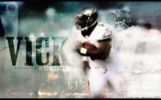 Football player holding football background - a football player holding free wallpaper