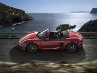 Red sports car ocean mountains - overhead in the sky free wallpaper