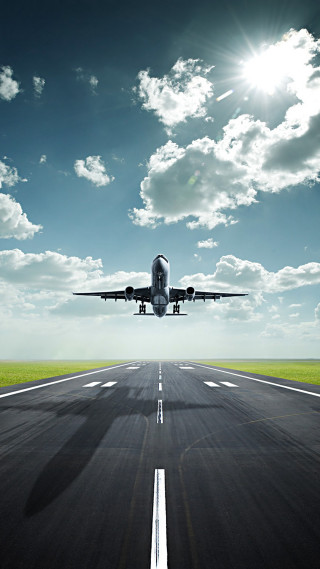 Jetliner runway blue sky clouds - free airplane wallpaper for mobile