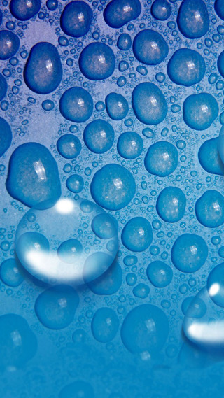 Water droplets blue surface macro 7 - a close up of water droplets free wallpaper for mobile