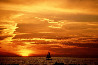 Sailboat ocean sunset dawn sky - a beautiful sky free wallpaper