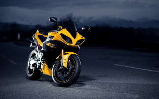 Yellow motorcycle parked night dark - a yellow motorcycle free wallpaper