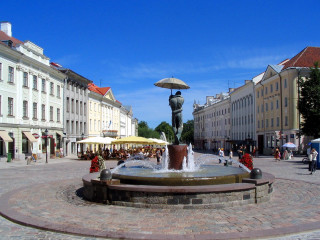 Fountain statue man umbrella square - a statue of a man holding free wallpaper