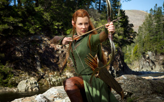 Woman green dress bow arrow 2 - a rock in a river free wallpaper