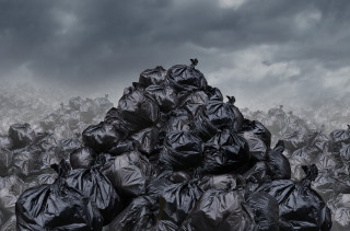Black trash bags field bird - a field under a cloudy sky free wallpaper
