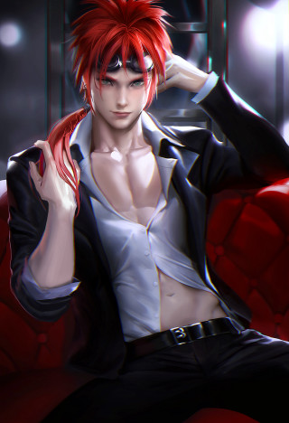 Red haired man sitting on - a red couch free wallpaper