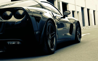 Black sports car parked road 2 - the side of the road in front free wallpaper