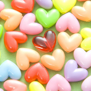 Heart shaped candies green surface 2 - free hearts wallpaper for tablet