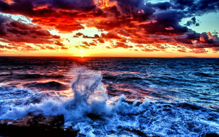 Sunset ocean wave boat clouds - colorful cloud free wallpaper