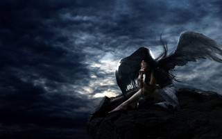 Woman wings sitting rock dark - a rock in the dark free wallpaper