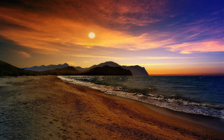 Beach sunset mountain blue sky - over the water free wallpaper for desktop