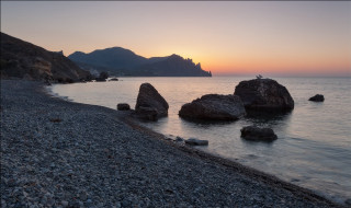 Beach rocks bird sunset mountains - exekia free wallpaper for desktop