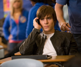 Young man desk talking cell - a desk free wallpaper