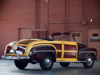 Yellow brown car brick building - a red brick wall behind free wallpaper