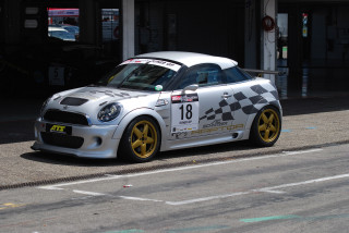 Silver car checkered design parked - a silver car free wallpaper