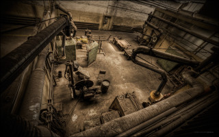 Industrial building pipes machinery inside - grim free wallpaper