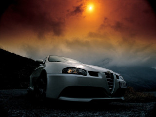 White car dirt road cloudy - the sun in the distance free wallpaper