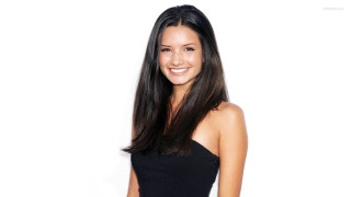 Woman black dress smiling white 2 - a white background behind her free wallpaper