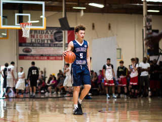 Young man dribbling basketball court - northwest school free wallpaper