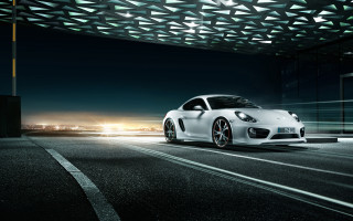 White sports car night city 9 - a city skyline in the background free wallpaper
