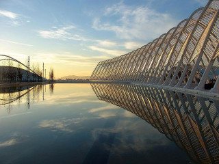 Large building water sky clouds 3 - a large body of water in front free wallpaper