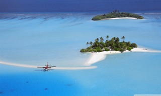 Small island plane over ocean - a small island free wallpaper